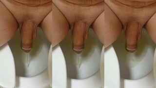 Guy pissing sitting down!