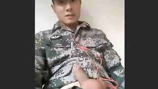 Cumshow, the uncut Asian soldier, gives a steamy handjob and takes a cumshot