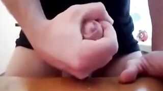 Watch this hunk stroke his massive cock and take a hot load in his mouth