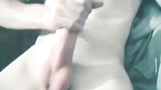 Watch this horny teen give a sloppy handjob and take a massive cumshot