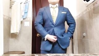 Watch this straight guy stroke his big dick in a suit and jerk off to a hot cumshot