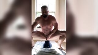 Hunk with muscle rides his dildo and cums hard