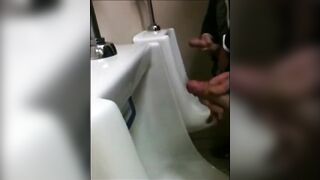 Watch two hairy studs stroke and jerk off their way to a hot orgasm in the urinal
