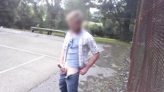 Watch this guy stroke his massive dick in public like a pro