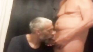 Watch these hairy guys give a sloppy handjob and cumshot to a lucky last-timer