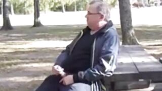 Watch this big-dicked daddy give a public handjob and get a hot load