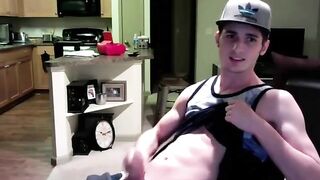 Amateur twink jerks off his big dong in his apartment with a cumshot
