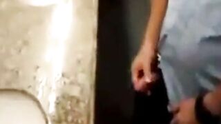 Join this kinky amateur in a public restroom and give him a hand