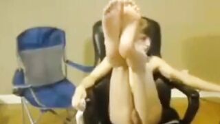 Amateur son enjoys giving his daddy a footjob while he jerks off
