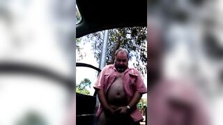 Hairy dude jerks off in public park with his straight friend's help